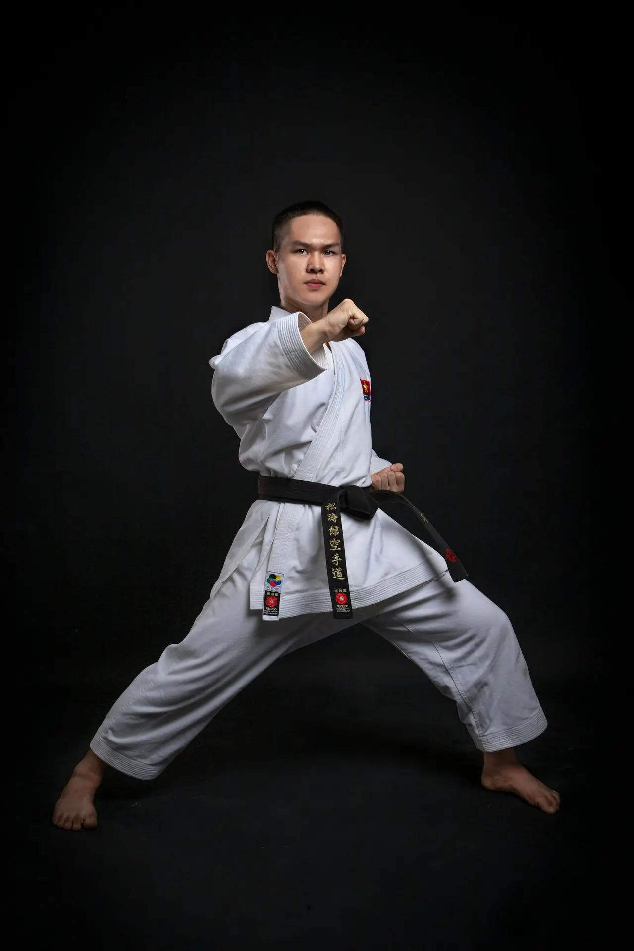 a man in a karate uniform
